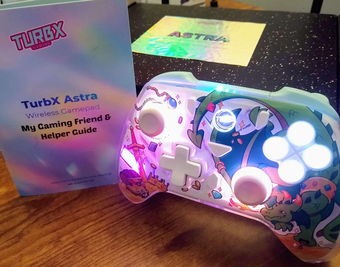 TurbX Controller Glowing controller and guidebook.